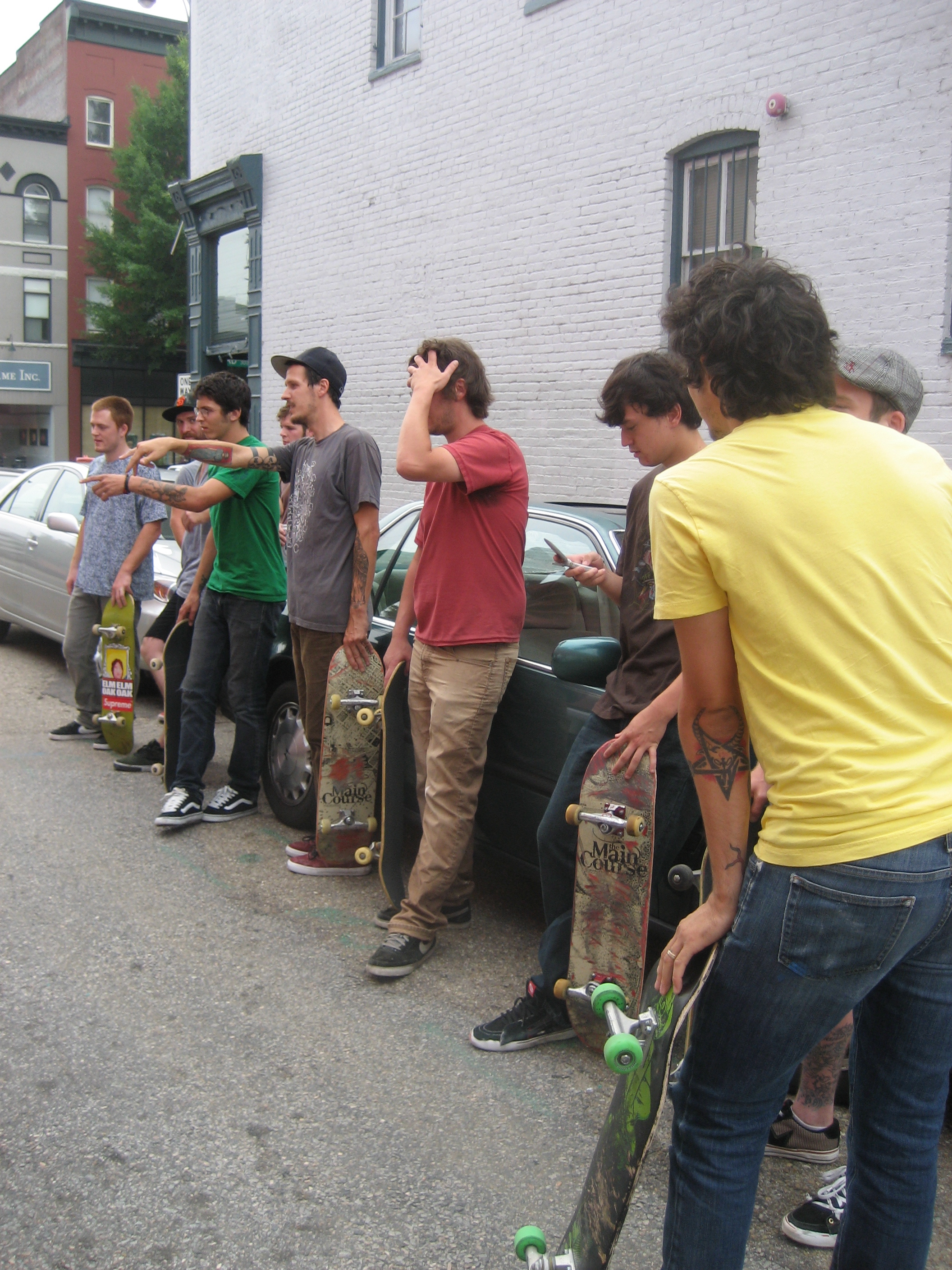 Skaters waiting to hit the ramp inside the gallery via side door
